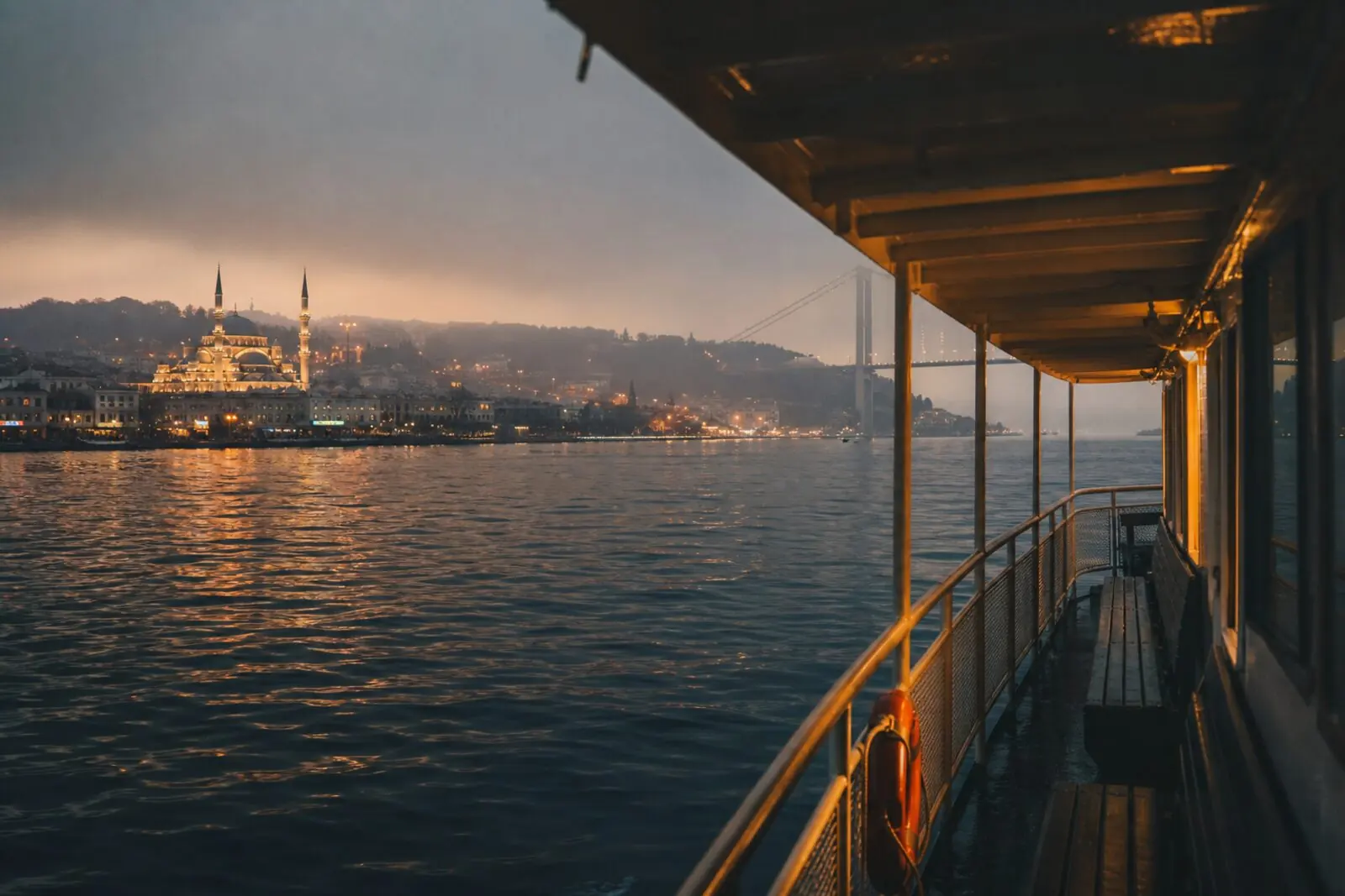 Bosphorus ferry at dusk — plan tattoo timing around walking, swimming, and flights